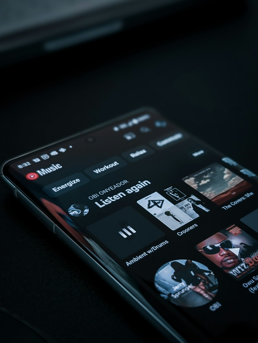 Smartphone screen displaying a music streaming application with album art.